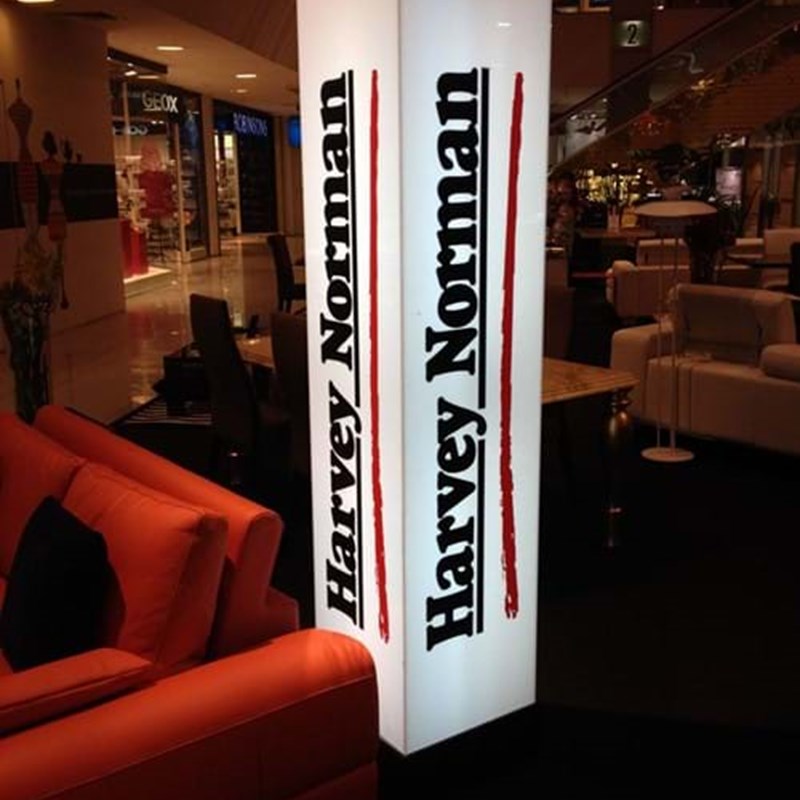 Illuminated display tower with branding
